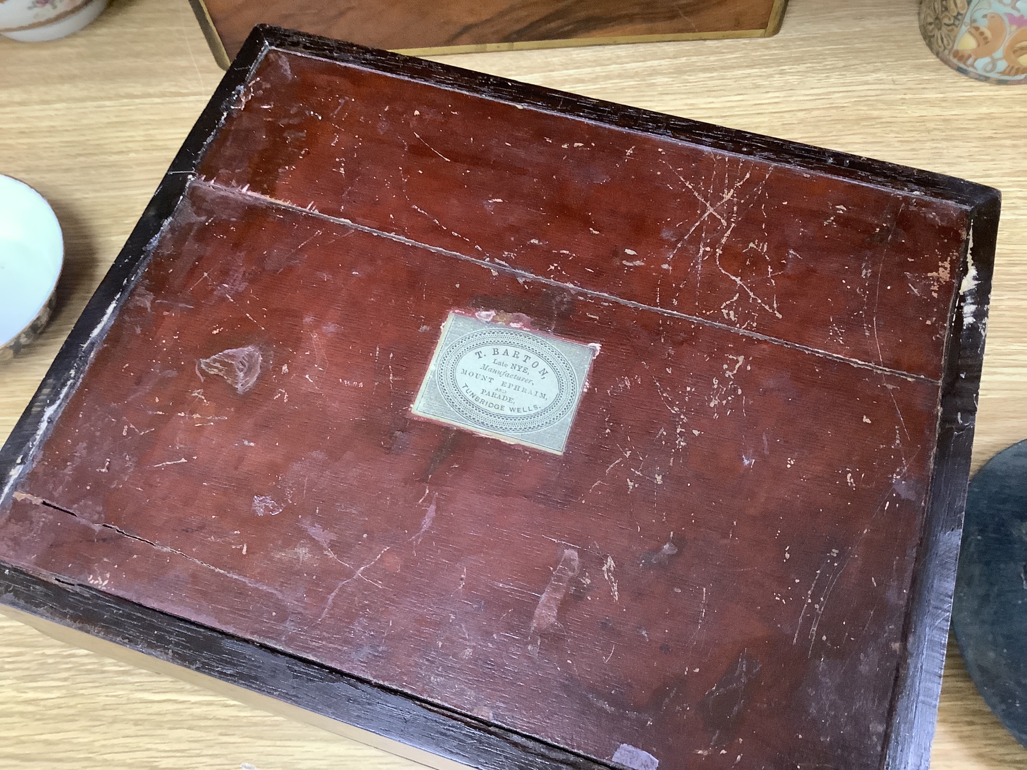 A walnu brass bound writing slope, an octagonal inlaid tea caddy and a Tunbridgeware box, 26cm wide, 22cm deep